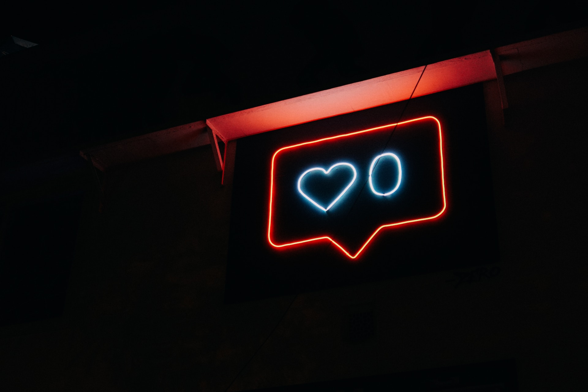A neon sign showing the number of instagram likes