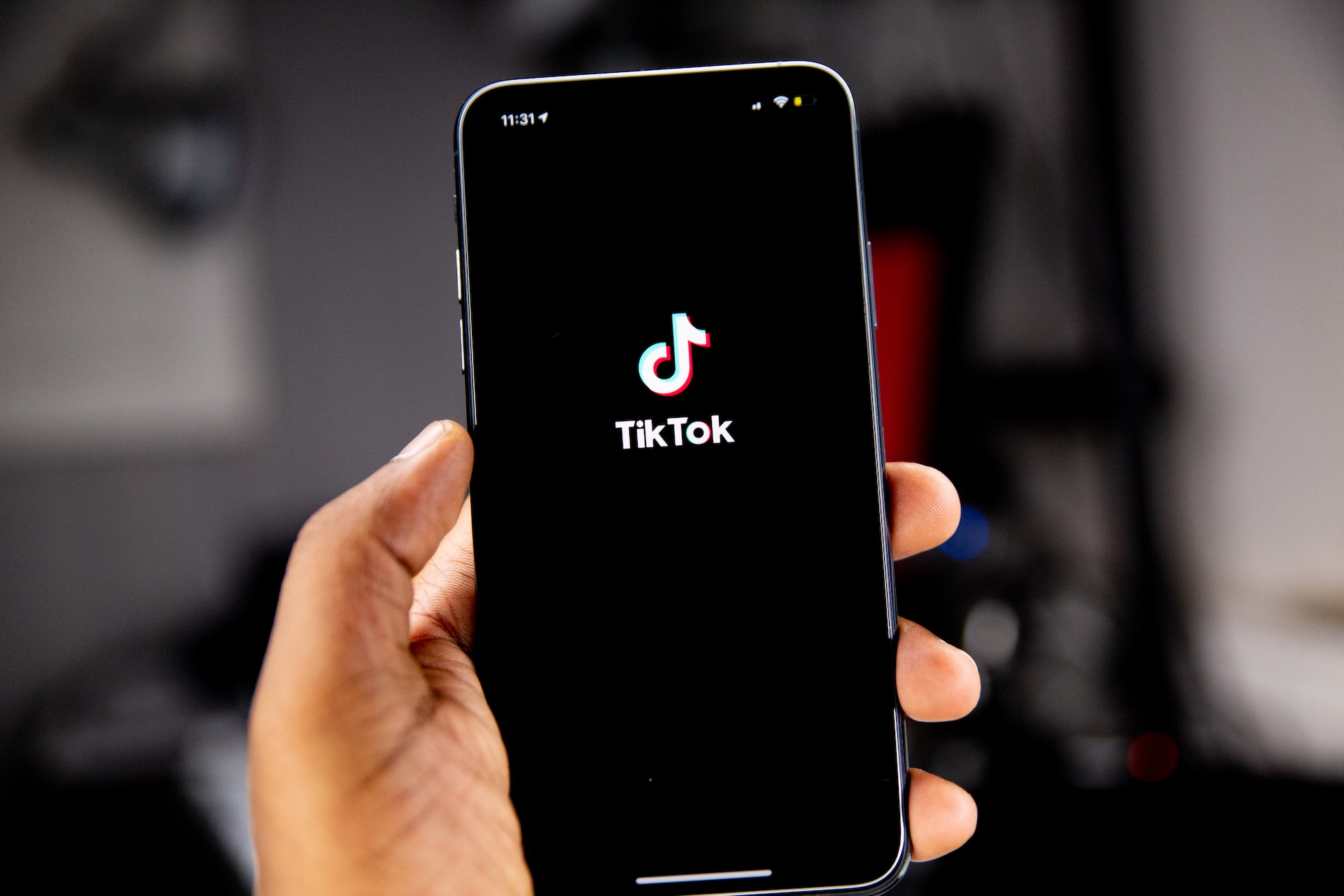 Photo of an iphone opening the tiktok app